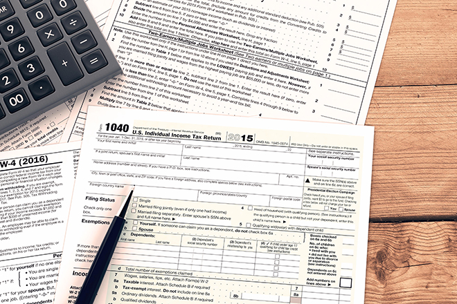 top view of forms for usa taxes with a pen and an electronic calculator, empty spaces for custom text at the right (3d render)
