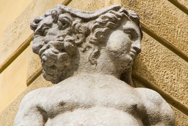 An old Janus sculpture showing the classical Roman god with heads facing in different directions.
