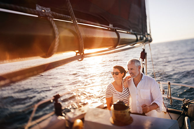 A man and woman on a sailboat