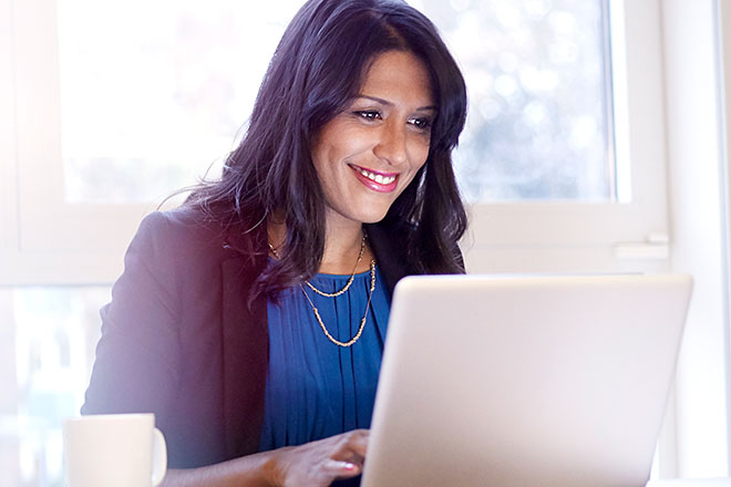 Woman looking at laptop