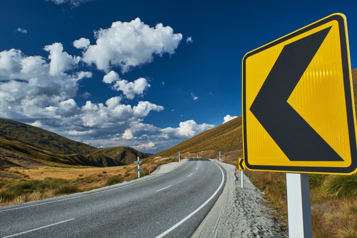 Twisty road with turn sign