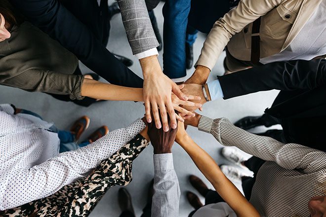 Hands of group of diverse people