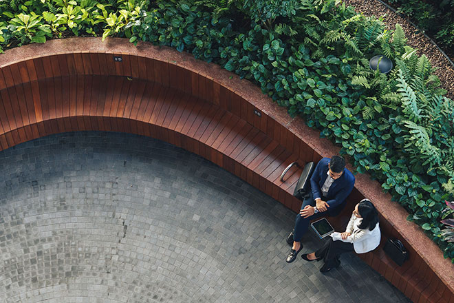 Business people meet on bench